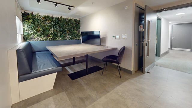 Bench seating table television and chair living area at 33 Parkside in Coventry Student Accommodation