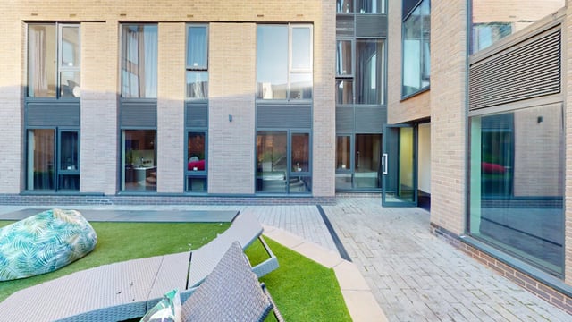 Bean bag chairs and loungers on grass exterior at 33 Parkside in Coventry Student Accommodation