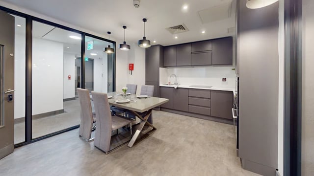 Dining table chairs kitchen counters cabinets kitchen at 33 Parkside in Coventry Student Accommodation