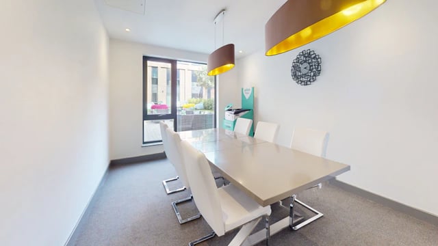 Dining table with white chairs and printer dining area at 33 Parkside in Coventry Student Accommodation