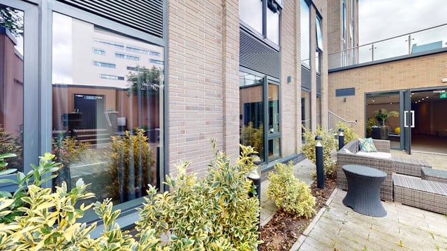 Wicker seating patio with plants exterior at 33 Parkside in Coventry Student Accommodation