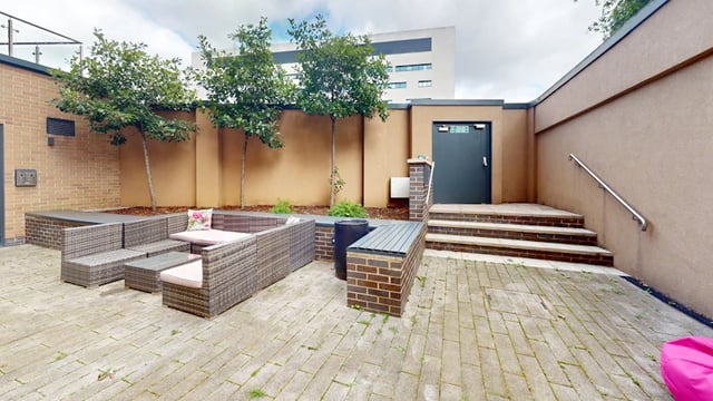 Outdoor seating area with wicker furniture exterior at 33 Parkside in Coventry Student Accommodation