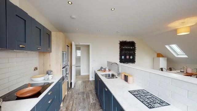 Modern blue and wood kitchen with island Kitchen at Picton Manor in Newcastle Upon Tyne Student Accommodation