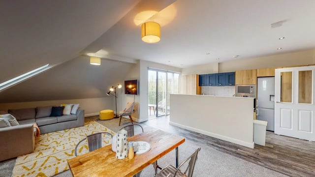 Sofa dining table kitchen appliances living room exterior at Picton Manor in Newcastle Upon Tyne Student Accommodation