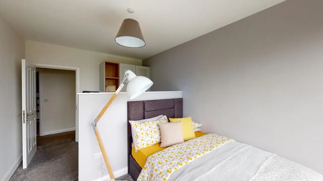 Bed with yellow bedding white lamp exterior bedroom at Picton Manor in Newcastle Upon Tyne Student Accommodation