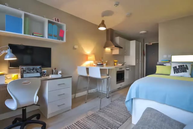 Desk bed kitchen and chairs studio apartment at James House in Bath Student Accommodation