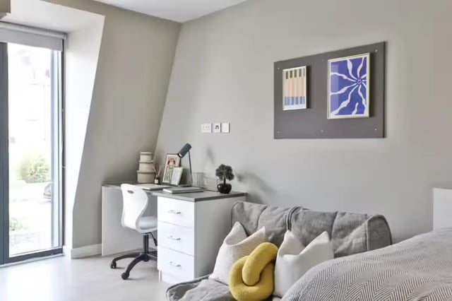 Desk with chair and sofa Bedroom at James House in Bath Student Accommodation