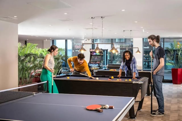 People play billiards and table tennis recreation room at Reynard House in Leicester Student Accommodation