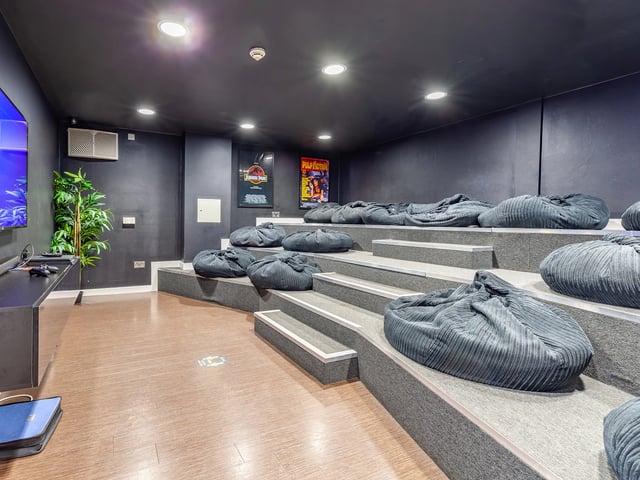 Tiered seating with beanbags and screen entertainment area at The Glassworks Newcastle in Newcastle Upon Tyne Student Accommodation