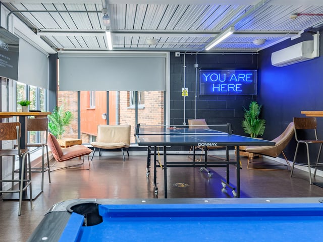 Ping pong table chairs and pool table recreation area at The Glassworks Newcastle in Newcastle Upon Tyne Student Accommodation