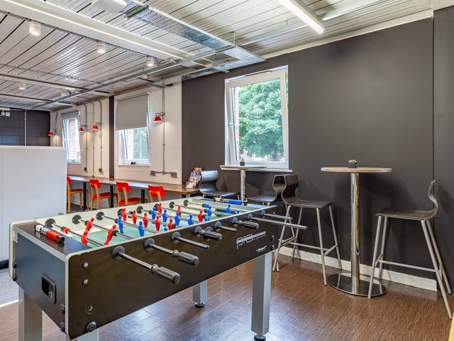 Foosball table chairs tables play area at The Glassworks Newcastle in Newcastle Upon Tyne Student Accommodation