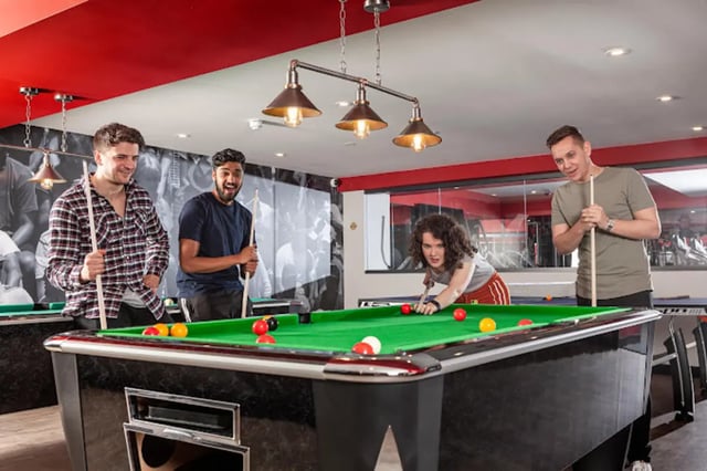 Students playing pool at tables recreation area at Study Inn Loughborough - Lemyngton Street in Loughborough Student Accommodation