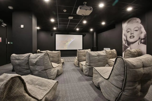Beanbag chairs facing projector screen Marilyn Monroe poster cinema room at William & Matthew House in Bristol Student Accommodation