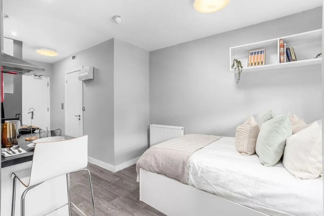Bed kitchen counter and chairs student studio apartment at Northgate House in Derby Student Accommodation