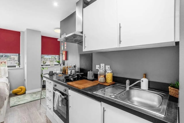 Modern kitchen with white cabinets sink stove kitchen at Northgate House in Derby Student Accommodation