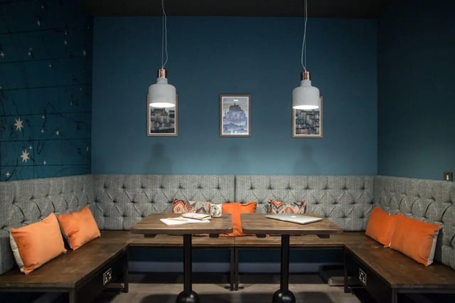 U-shaped bench seating with tables and lamps at King's Stables Road in Edinburgh Student Accommodation