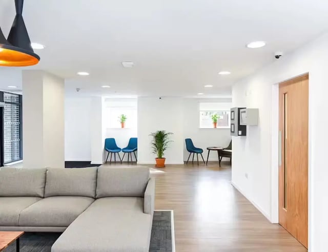 Sofa chairs and plants in common area at Pittodrie Street in Aberdeen Student Accommodation