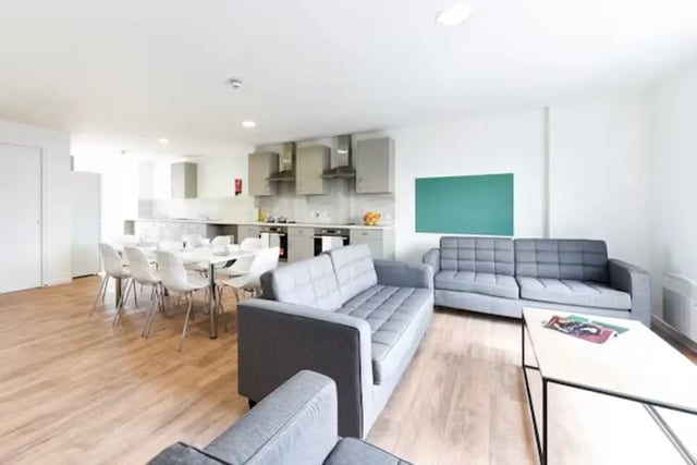 Sofas dining table kitchen cabinets living room at Pittodrie Street in Aberdeen Student Accommodation