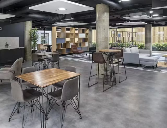 Wooden table with chairs modern lounge area at Pittodrie Street in Aberdeen Student Accommodation