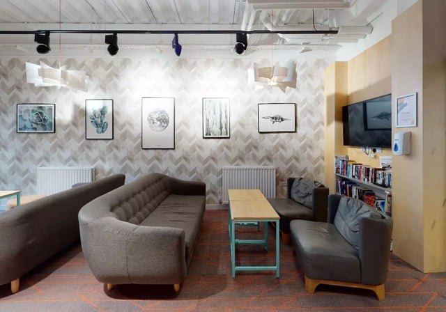 Sofas tables and framed art in common area at iQ Collingwood in Newcastle Upon Tyne Student Accommodation