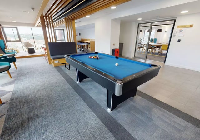 Pool table with balls and cues communal living area at iQ Century Square in Sheffield Student Accommodation