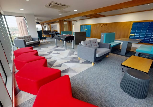 Sofas foosball table mailboxes communal lounge at iQ Century Square in Sheffield Student Accommodation