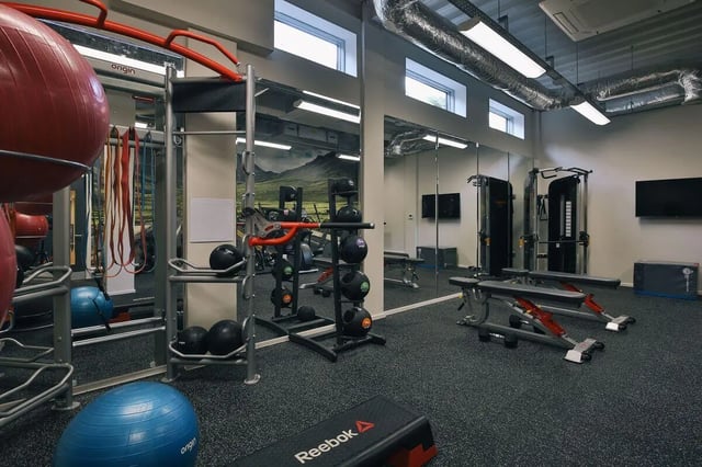 Gym equipment including balls weights and benches gym area at Picturehouse Apartments in Exeter Student Accommodation