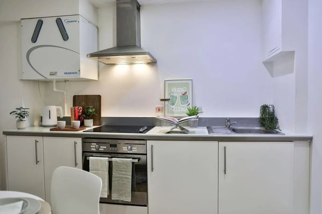 White cabinets induction hob sink kettle and oven Kitchen at Picturehouse Apartments in Exeter Student Accommodation