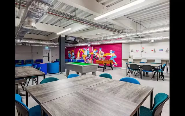 Pool table foosball and seating area communal space at Medici in Nottingham Student Accommodation