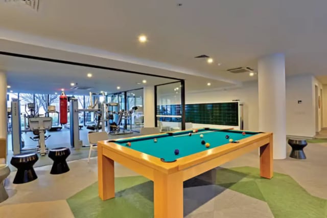 Pool table and gym equipment recreation area at Scape at University of Sydney in Sydney Student Accommodation