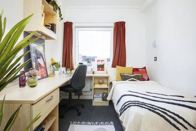 Bed desk chair window and pillows bedroom at Harriet Martineau in Birmingham Student Accommodation