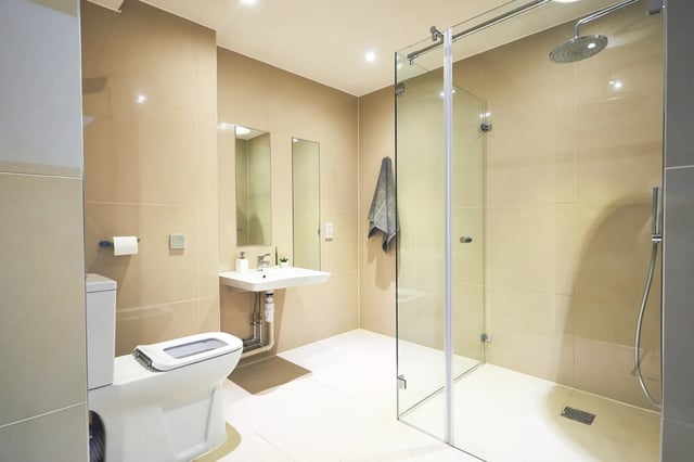 Toilet sink glass shower towel bathroom at Vita Student Richmond House in Southampton Student Accommodation