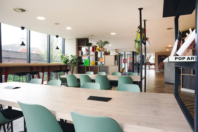 Large light wood table mint chairs study area at Vita Student Richmond House in Southampton Student Accommodation