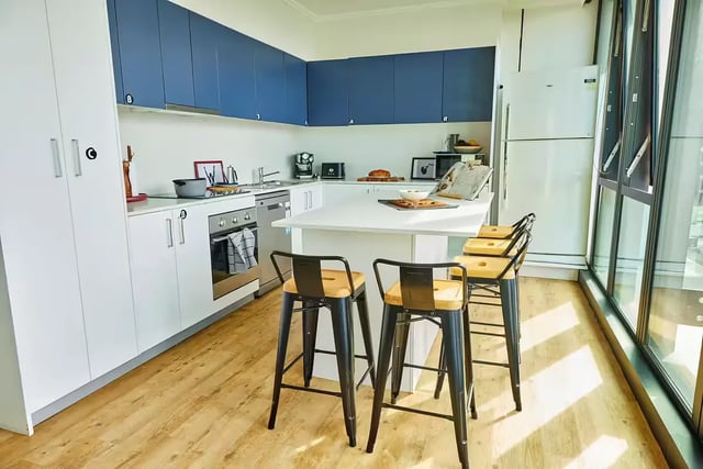 Modern kitchen with island and stools kitchen at Scape Quay in Sydney Student Accommodation