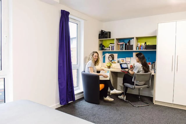 Two students studying at desks white wardrobe study area at Queen's Park House in Coventry Student Accommodation