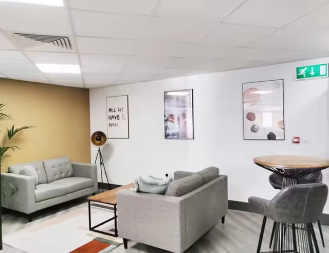 Two sofas coffee table artwork living room at Hydrogen in Nottingham Student Accommodation