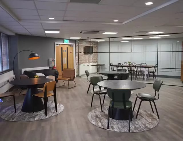 Modern common area with sofas tables and chairs lounge at Hydrogen in Nottingham Student Accommodation