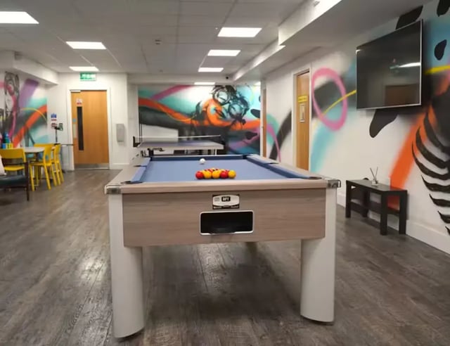 Pool table with balls and ping pong table recreation area at Hydrogen in Nottingham Student Accommodation