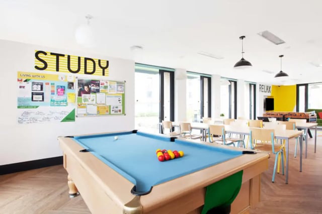 Pool table bulletin boards study area and tables living room at Dorset House in Oxford Student Accommodation