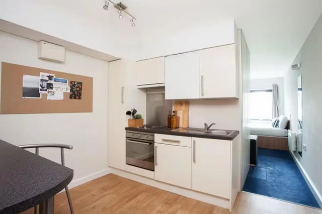 Corkboard oven sink cabinets kitchen and bedroom at Dorset House in Oxford Student Accommodation
