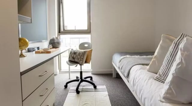 Desk bed chair and globe bedroom at East Shore in St Andrews Student Accommodation