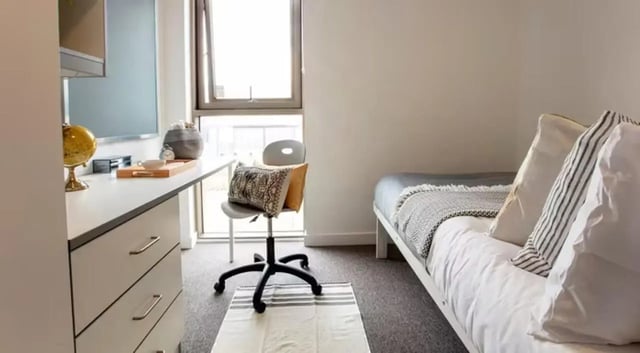 Desk bed chair globe cup pillows bedroom at East Shore in St Andrews Student Accommodation