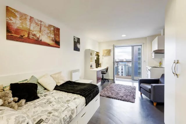 Bed desk chair rug armchair kitchen studio apartment at Lucas Studios in Birmingham Student Accommodation
