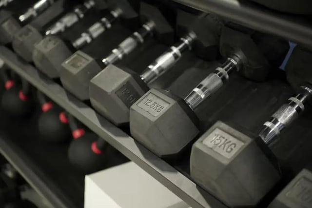 Dumbbells on a rack gym equipment at The Old Fire Station - Birmingham in Birmingham Student Accommodation