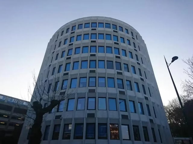 Curved building with many blue windows exterior at Mercury House in Bournemouth Student Accommodation