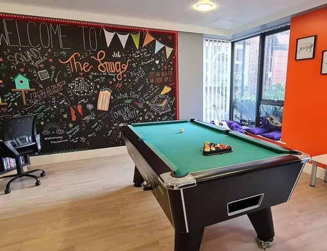 Pool table with balls and chalk board wall common area at Tramways in Chester Student Accommodation