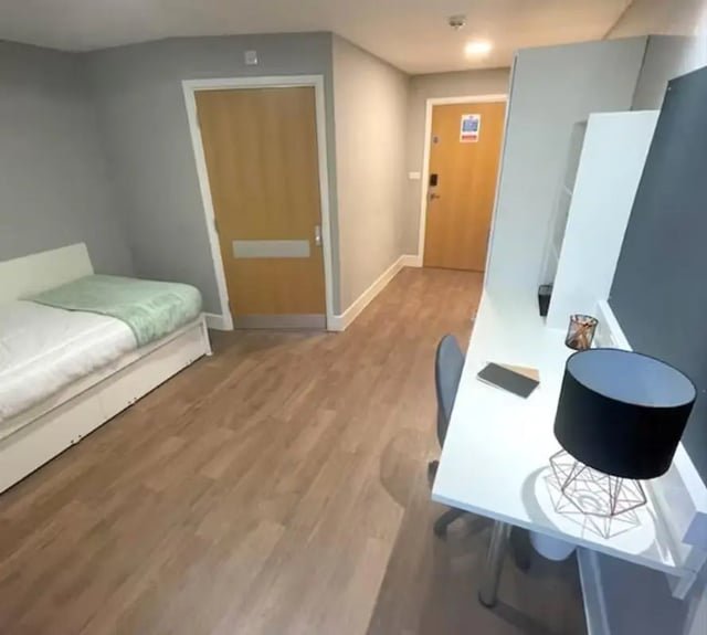 Bed desk lamp and chair bedroom at Tramways in Chester Student Accommodation