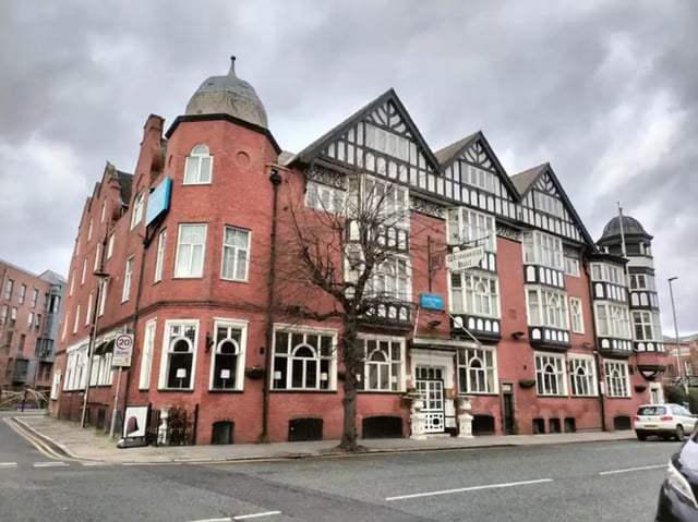Red brick building with multiple windows exterior at Tramways in Chester Student Accommodation