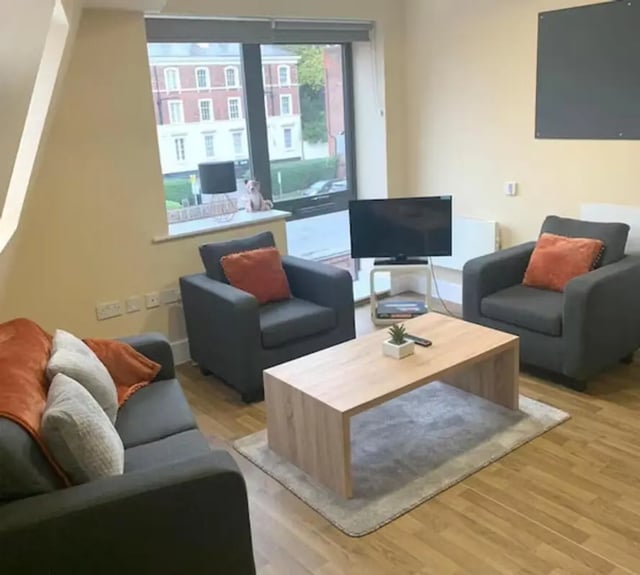 Sofa two armchairs coffee table living room at Tramways in Chester Student Accommodation