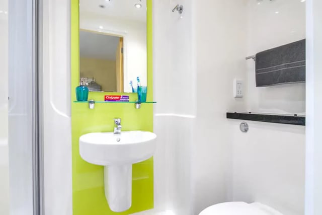 Sink mirror toothbrush holder Colgate toothpaste bathroom at Llys Y Deon in Bangor Student Accommodation